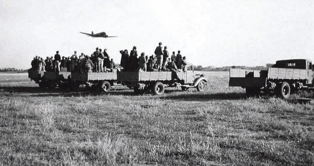 Evacuees from Weihsien camp assemble at the airfield